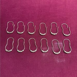 Set of 12 rolling shower curtain hangers